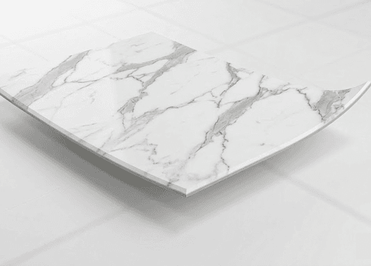 Vinyl compressed tile with veined marble pattern for commercial spaces